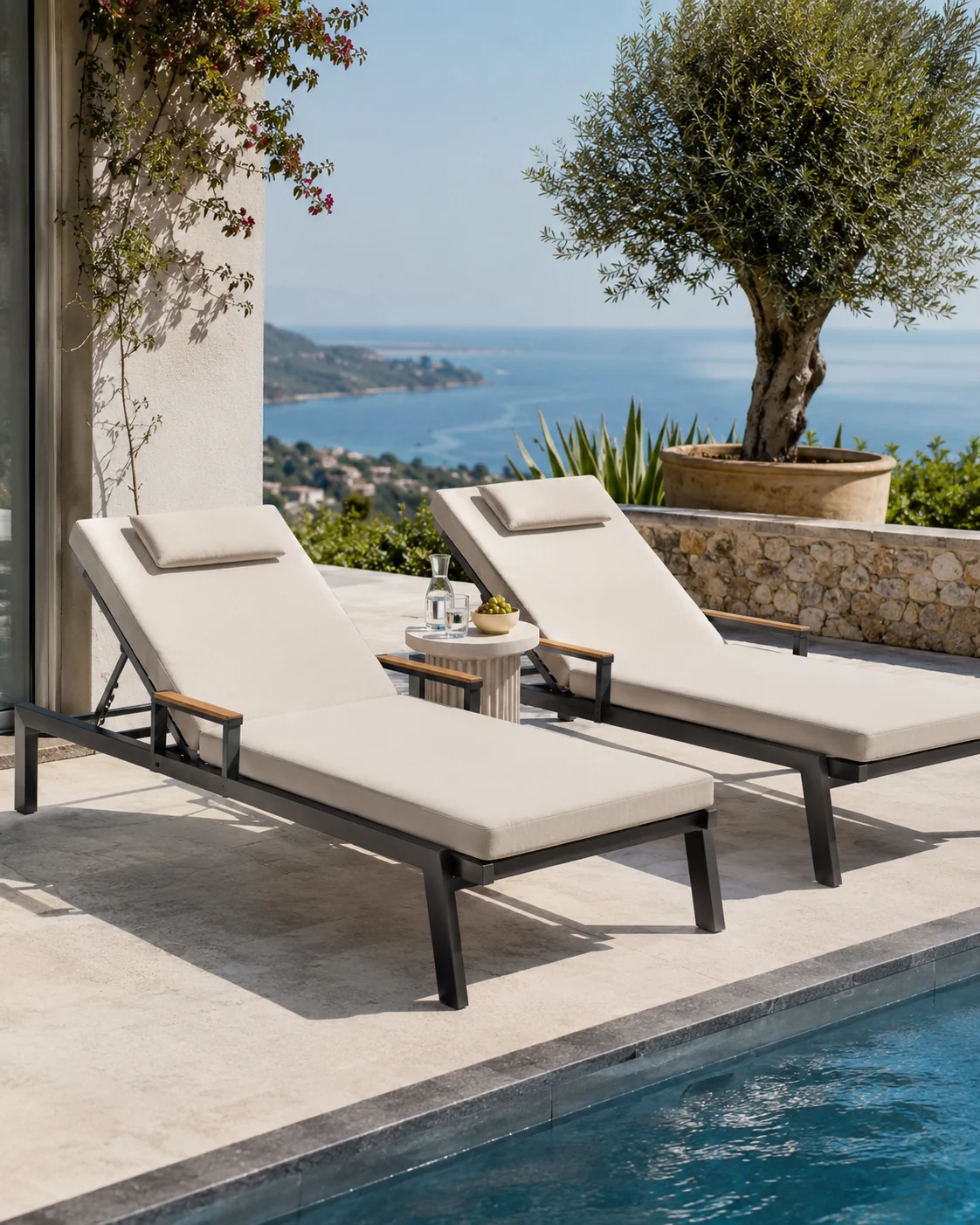 Two poolside sun loungers with cream cushions